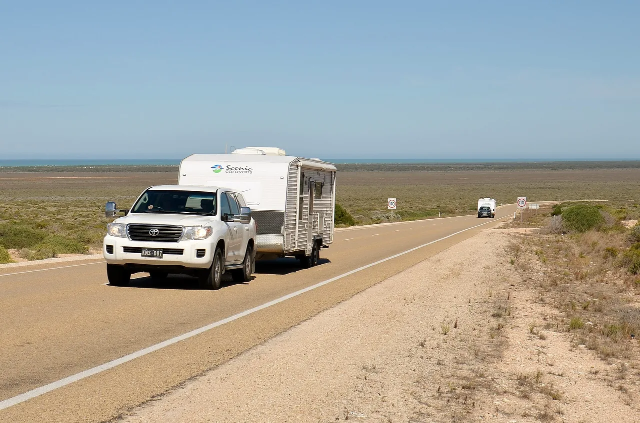 Toyota LandCruiser 200 Series towing a caravan on the Eyre Highway in Western Australia