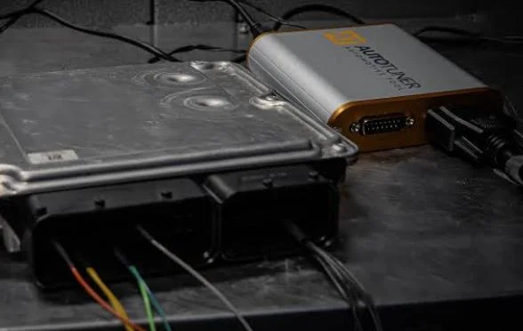 AutoTuner connected to an ECU on a workshop programming bench
